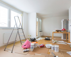 Home renovation room full of painting tools